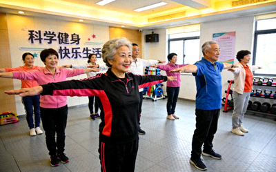 上海某社区健身活动中心内景 - 居民正在参与集体健身课程